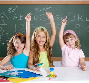 Student success - girls in raising hands